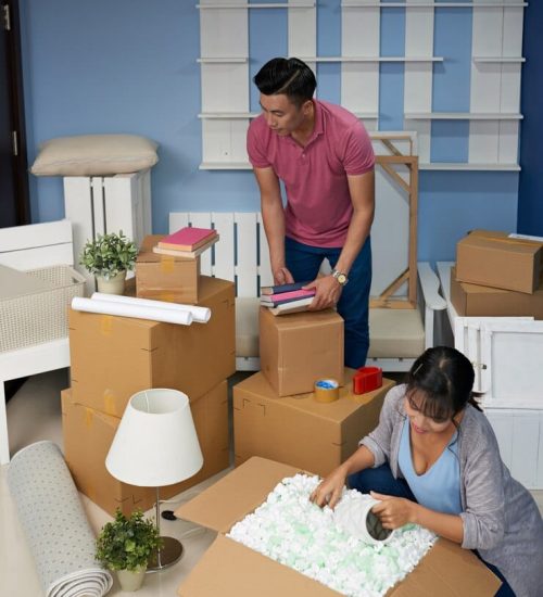 couple-unpacking-boxes-home couple-unpacking-boxes-home